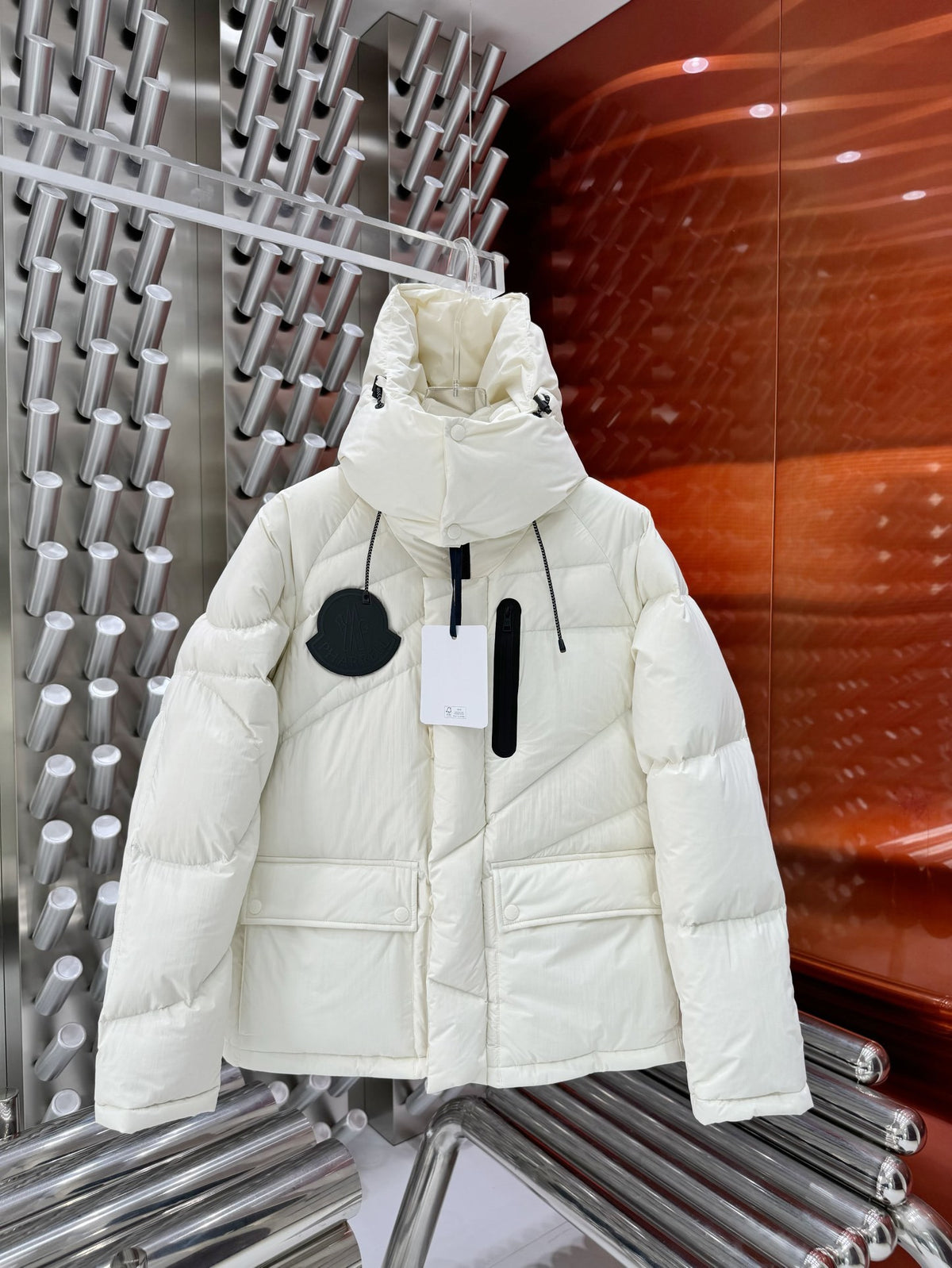 Moncler White Oversized Down Jacket – Black Contrast Badge Diagonal Baffles Funnel Neck Stow Hood Black Interior Lining Moncler Outerwear