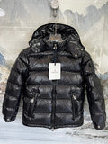 Moncler Black Classic Down Hooded Jacket – High-Gloss Lacquered Shell Wide Baffles Integrated Hood Comic-Strip Label Moncler Outerwear