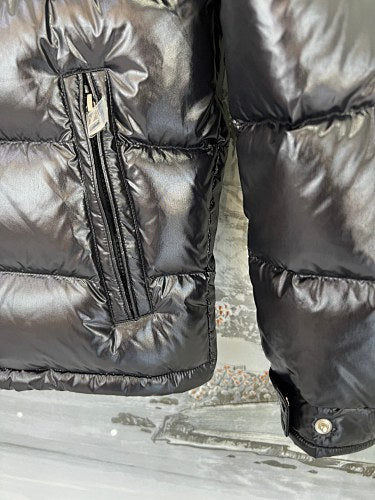 Moncler Black Classic Down Hooded Jacket – High-Gloss Lacquered Shell Wide Baffles Integrated Hood Comic-Strip Label Moncler Outerwear