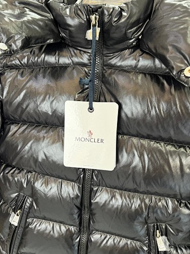Moncler Black Classic Down Hooded Jacket – High-Gloss Lacquered Shell Wide Baffles Integrated Hood Comic-Strip Label Moncler Outerwear