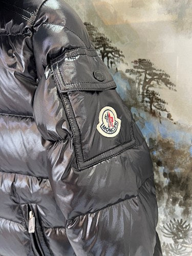 Moncler Black Classic Down Hooded Jacket – High-Gloss Lacquered Shell Wide Baffles Integrated Hood Comic-Strip Label Moncler Outerwear