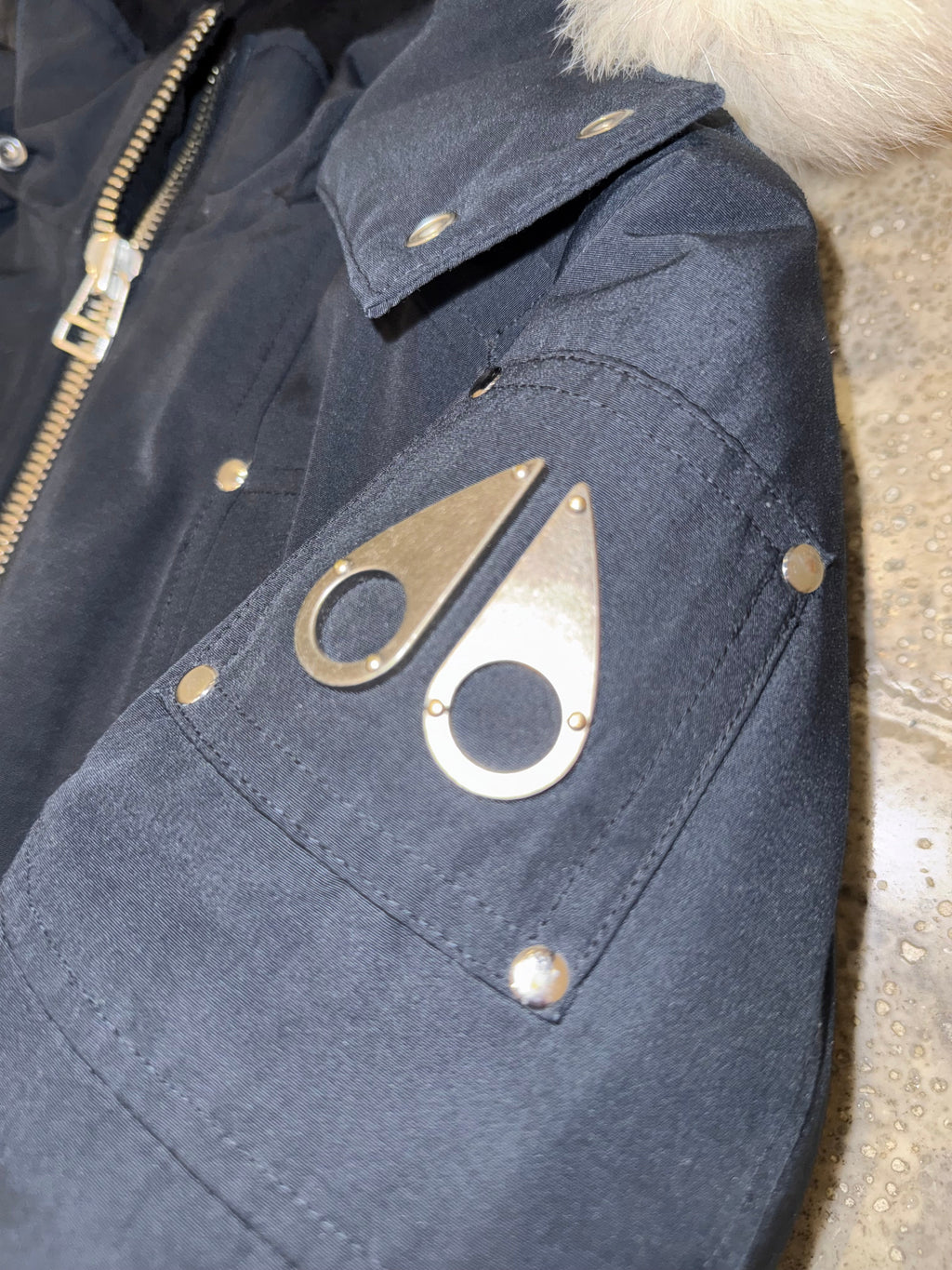 Moose Knuckles Slate Blue Fur-Trim Hooded Bomber Jacket – Cream Fur Hood Silver Logo Badge Quad Snap Pockets Black Ribbed Trim Silver Zip Moose Knuckles Outerwear