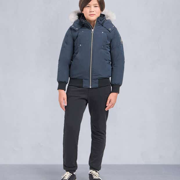 Moose Knuckles Slate Blue Fur-Trim Hooded Bomber Jacket – Cream Fur Hood Silver Logo Badge Quad Snap Pockets Black Ribbed Trim Silver Zip Moose Knuckles Outerwear